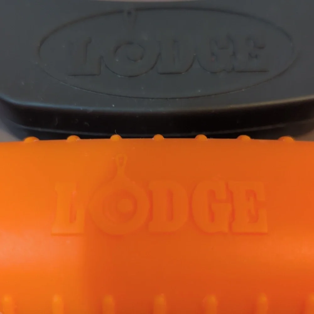 Silicone Lodge cast iron orange hot handle holder and blk assist handle holder